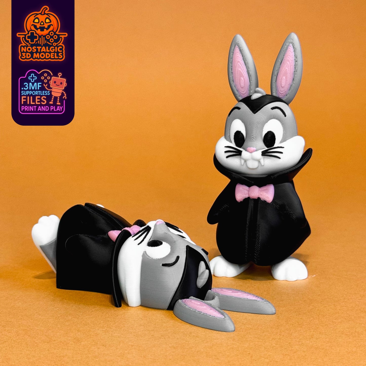 Photo of two printed flexi Bugs Bunny Dracula figures one standing and one lying down on an orange background. Vibrant black, pink, and grey colours show detail of the 3D print.
