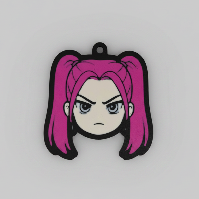 3D printed keychain of Mira from K-Pop Demon Hunter, featuring her signature hot pink twin pigtails, intense grey-blue eyes, and a fierce frowning expression that captures her fiery personality.