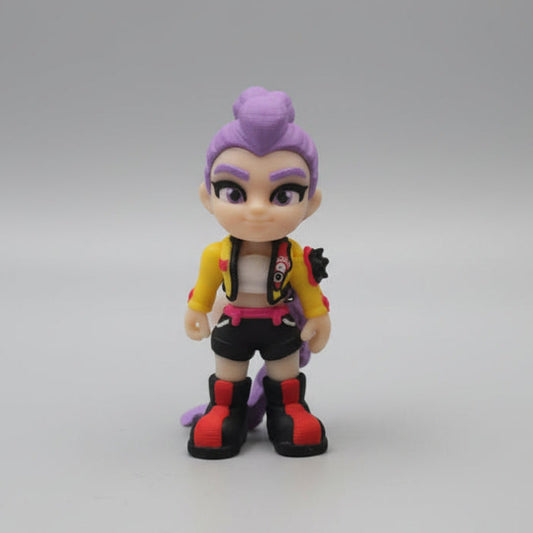 Front view of a 3D printed Rumi figure from Kpop Demon Hunters with purple hair in a high bun, a confident expression, a yellow jacket, black shorts, and red and black boots, displayed on a neutral background.