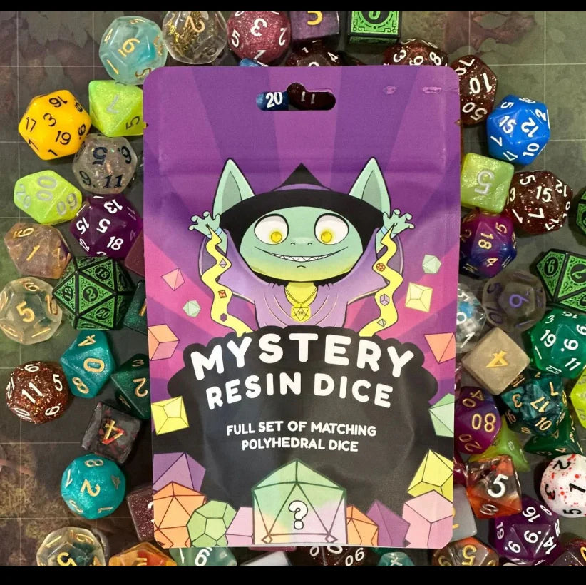 Packaging of Mystery Acrylic Dice with colorful dice in the background
