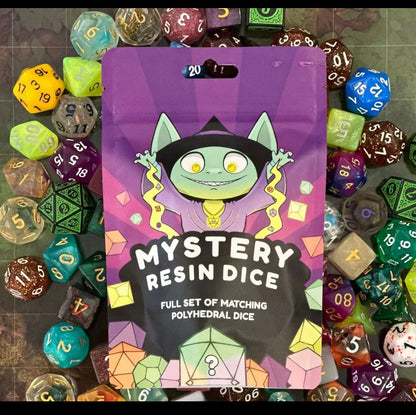 Packaging of Mystery Acrylic Dice with colorful dice in the background