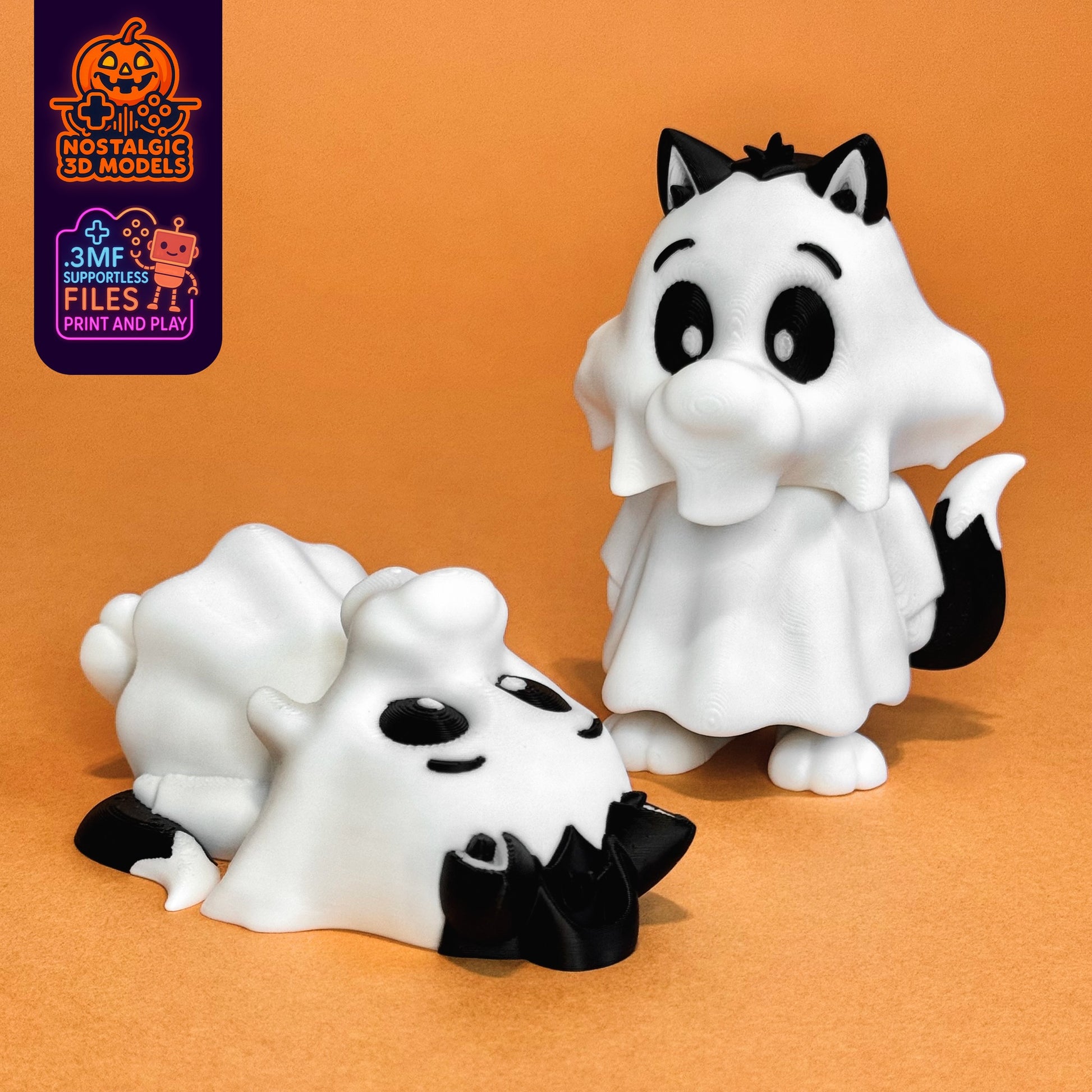 Two 3D printed Sylvester figures dressed in ghost costumes stand on an orange surface. One Sylvester is standing confidently in a white sheet with black tail and ears visible, while the other lies playfully on its side. Halloween branding and "3MF supportless files" label are visible in the corner.