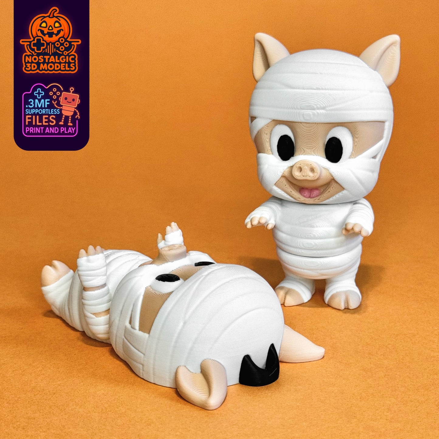 Two 3D printed Porky Pig Mummy figures shown on an orange background. One is standing and smiling sweetly in full mummy wrappings, while the other lies playfully on its back, wrapped in bandages from head to toe. Features the “Nostalgic 3D Models” and “Print & Play” logos in the corner.