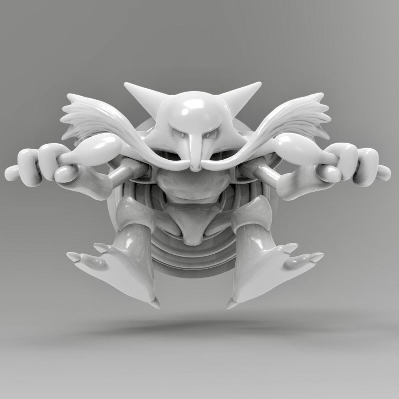 A 3D printed Alakazam Pokémon wall décor figure in smooth grey resin. Alakazam is posed in a dynamic forward stance, holding two spoons in its hands with its arms extended wide, giving it a powerful and intimidating look. The model is highly detailed, with sharp edges, strong features, and a raised circular backdrop that frames the character.