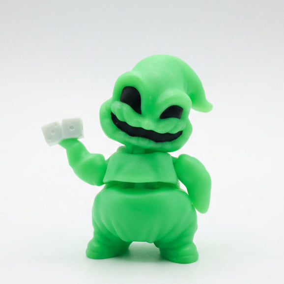Glow-in-the-dark green articulated Oogie Boogie Flexi Friend holding a pair of white dice