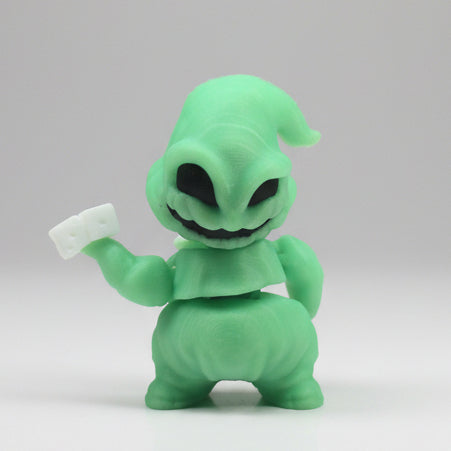 Glow-in-the-dark Oogie Boogie Flexi Friend glowing bright green in a dark room while holding white dice.