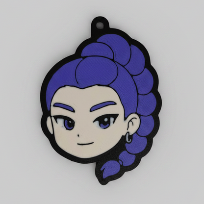 3D printed keychain of Rumi from K-Pop Demon Hunter, featuring her signature purple braided hair styled in a high ponytail, bold eyebrows, and confident expression. Displayed on a dark background with a small loop for keyring attachment.