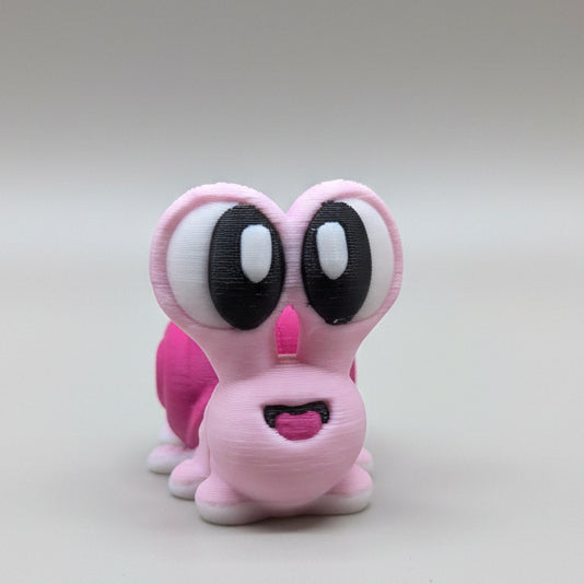 Front view of a pink flexi snail figure with large cartoon eyes