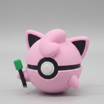 Side view of Jigglypuff inspired Pokéball 3D print showing pink colouring, pointed ears, swirl hair detail, and microphone accessory.