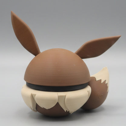 Back view of Eevee inspired Pokéball 3D print showing large pointed ears, brown body, fluffy cream fur details, and cute display style.