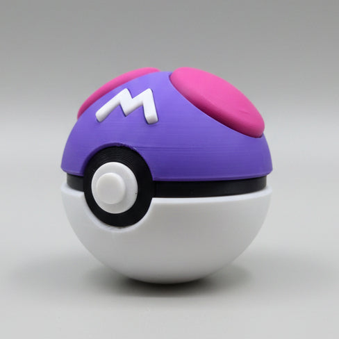 Angled side view of a 3D printed Master Ball showing the purple dome, raised white “M” detail, pink accent panels, and circular white centre button.