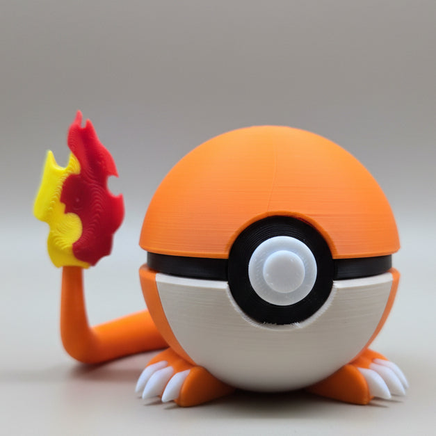 Front view of a 3D printed Charmander-inspired Poké Ball with orange top, white base, black centre band, small white claws, and a flame-tipped tail on a neutral background.