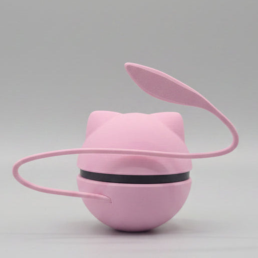 Pink filament poke ball with a black strap around it and a pink  ears and long winding pink tail on a gray background