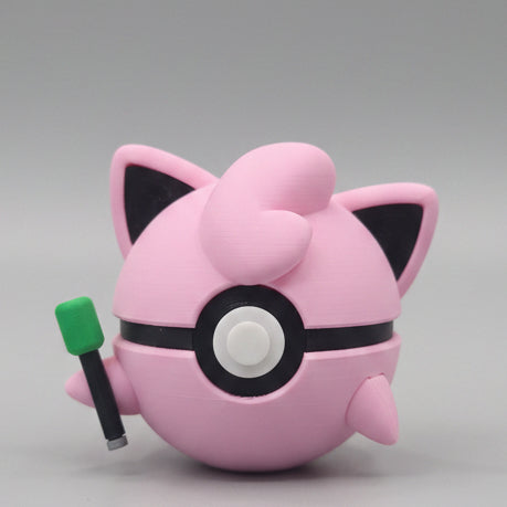 Jigglypuff inspired 3D printed Pokéball collectible featuring a pink design, cute ears, signature curl, microphone detail, and adorable display style for Pokémon fans.
