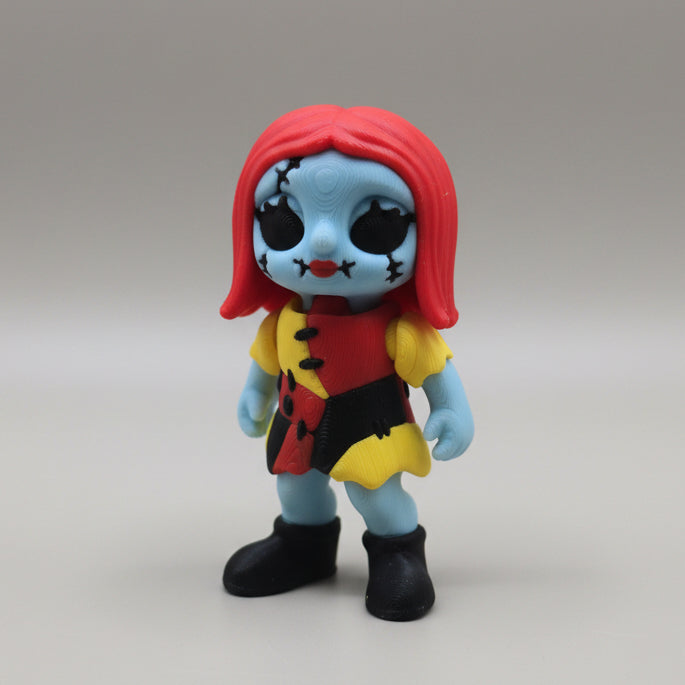 Front view of a Sally inspired 3D printed flexi figure with red hair and stitched details