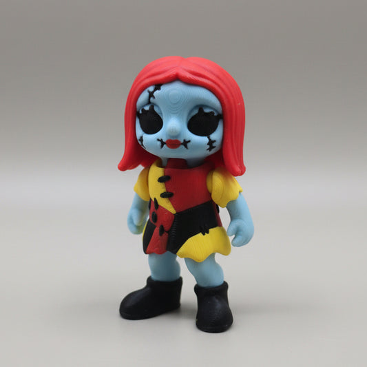 Front view of a Sally inspired 3D printed flexi figure with red hair and stitched details