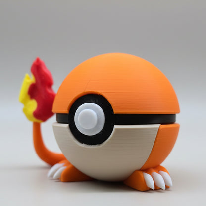 Side profile of a 3D printed Charmander-themed Poké Ball highlighting the raised flame tail and small white claws beneath the sphere.