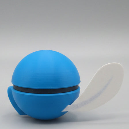 Back view of Poliwag inspired Pokéball collectible showing the smooth blue finish and clear tail detail.