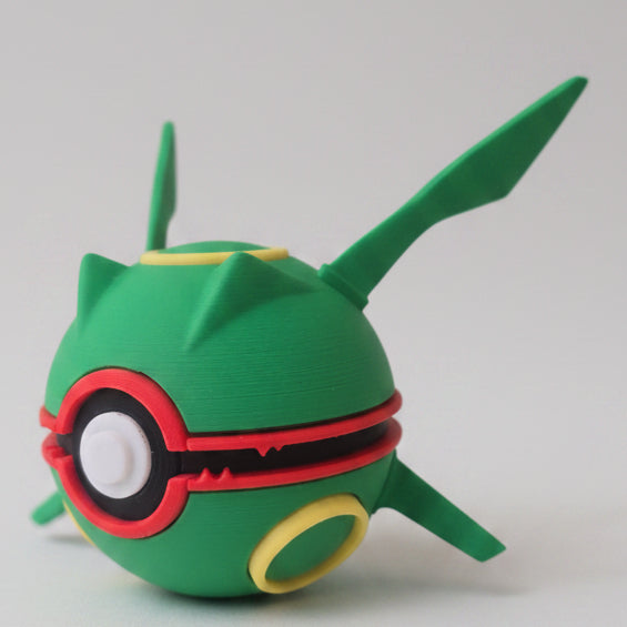 Side view of Rayquaza inspired Pokéball 3D print showing green colouring, red accents, yellow markings, and dragon inspired details.