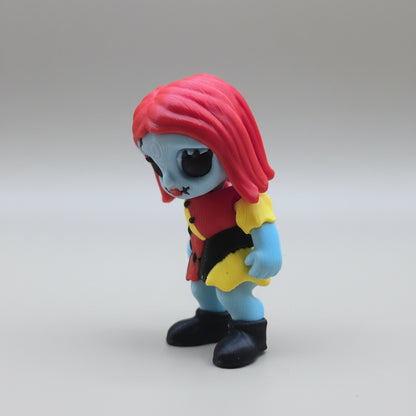 Side view of a Sally 3D printed flexi figure with red hair and black boots