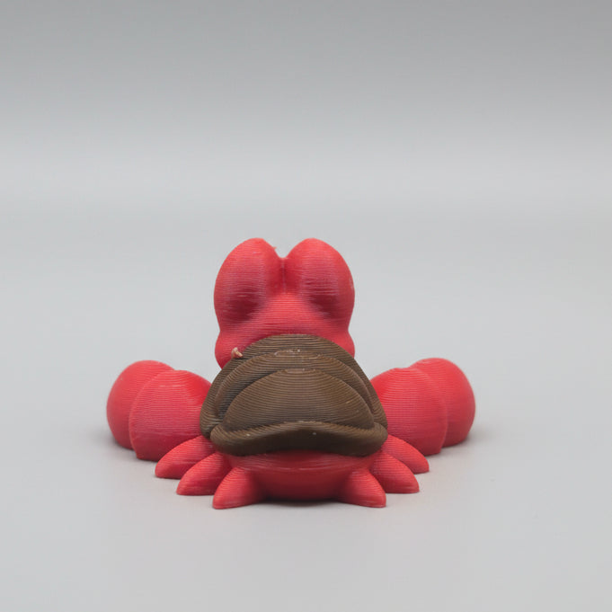 Rear view of a Sebastian 3D printed flexi crab figure showing brown shell detail