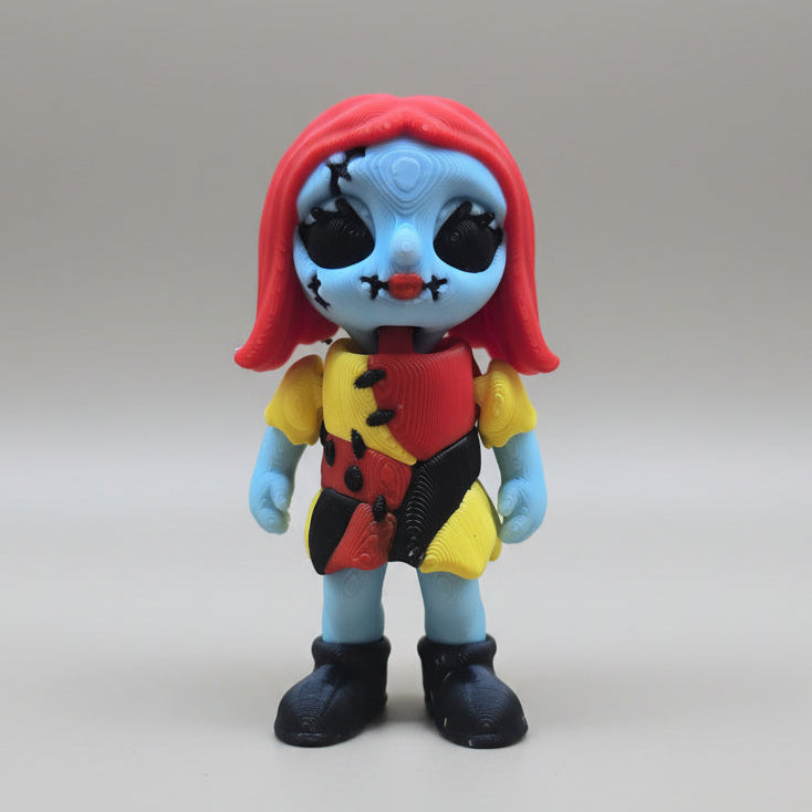 Slight angled front view of a Sally flexi figure showing dress and facial details