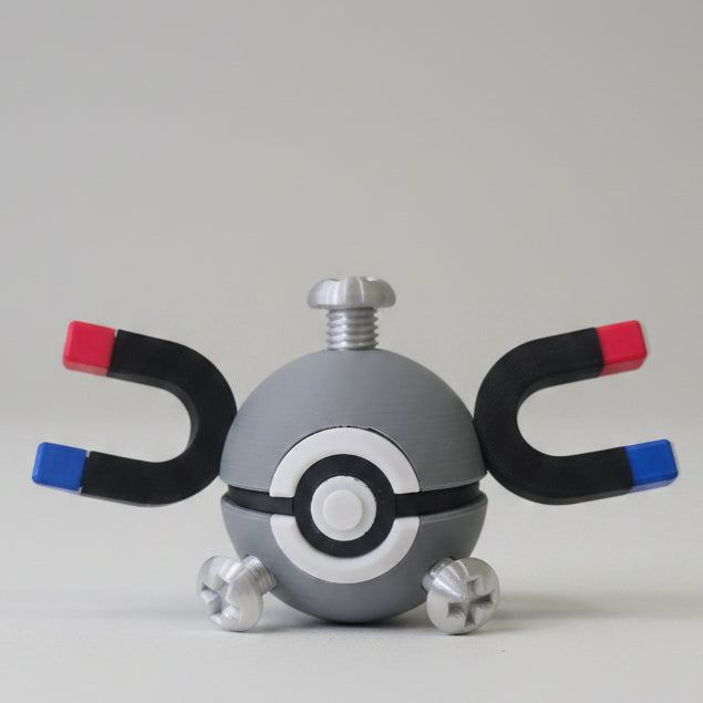 Magnemite inspired 3D printed Pokéball collectible featuring metallic grey colouring, magnet arms, screw details, and Electric-type Pokémon themed design for fans and collectors.