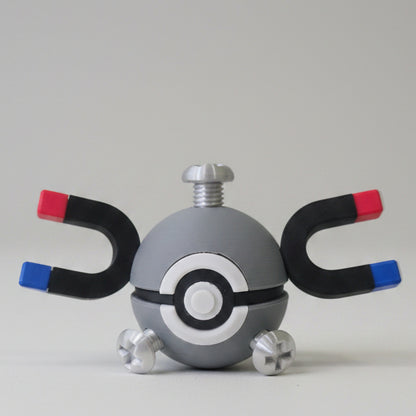 Magnemite inspired 3D printed Pokéball collectible featuring metallic grey colouring, magnet arms, screw details, and Electric-type Pokémon themed design for fans and collectors.