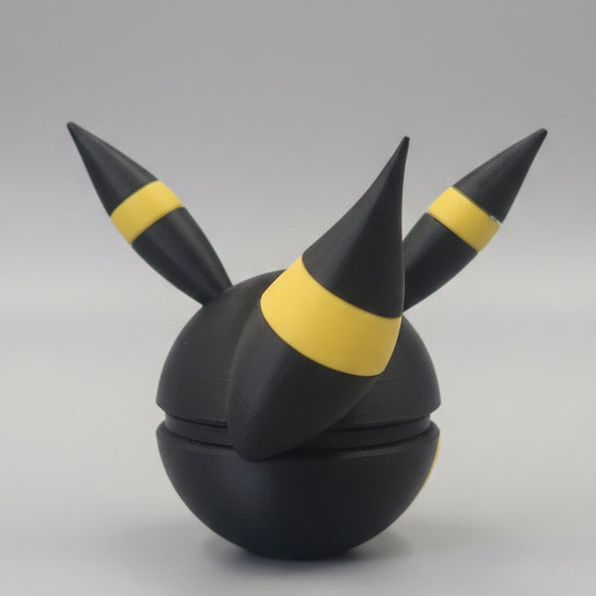 Back view of Umbreon inspired Pokéball 3D print showing black colouring, yellow ring accents, pointed ears, and sleek Eeveelution themed design.
