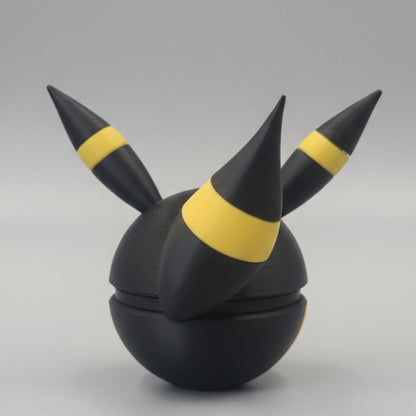 Back view of Umbreon inspired Pokéball 3D print showing black colouring, yellow ring accents, pointed ears, and sleek Eeveelution themed design.