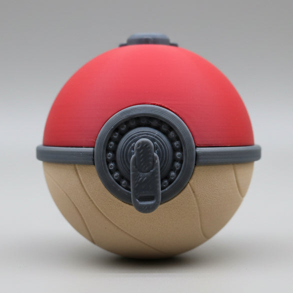 Front view of a 3D printed Hisuian Poké Ball featuring a red top, textured tan base, and detailed grey mechanical latch centered on the front, displayed on a plain background.