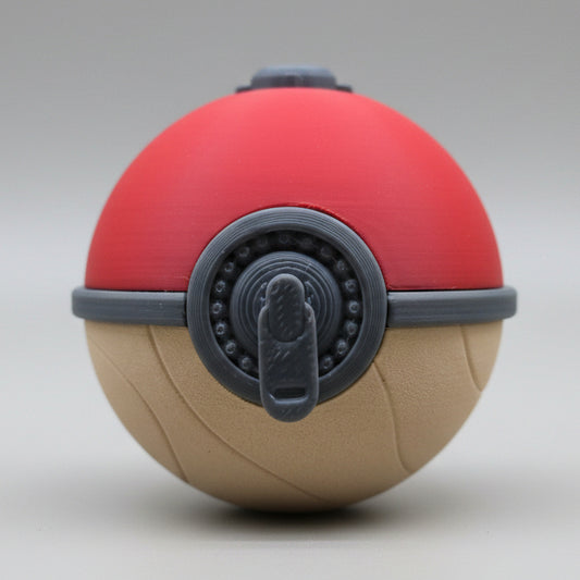 Front view of a 3D printed Hisuian Poké Ball featuring a red top, textured tan base, and detailed grey mechanical latch centered on the front, displayed on a plain background.