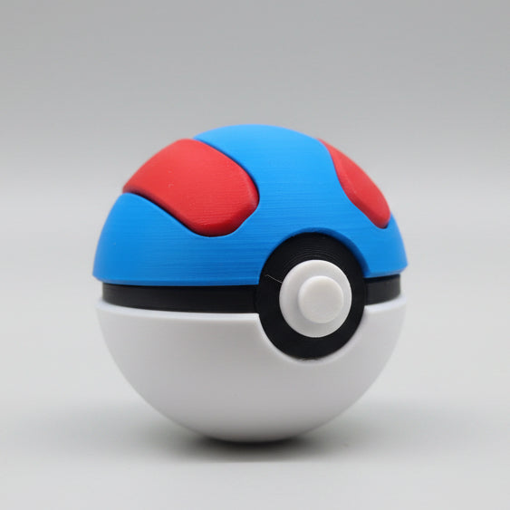 Angled view of a 3D printed Great Ball showing the blue dome, red detailing on top, black band, and circular white centre button.
